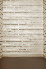 white brick wall with tiled floor, abstract background photo