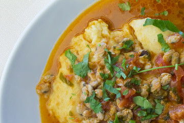 corn polenta with arselle clams and tomato sauce