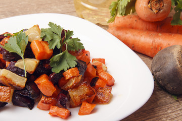 Salad baked beetroot, fresh carrots and potatoes. Healthy food from organic products