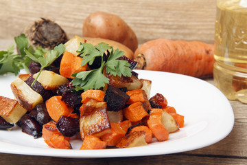 Salad baked beetroot, fresh carrots and potatoes. Healthy food from organic products