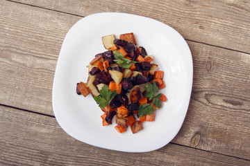 Salad baked beetroot, fresh carrots and potatoes. Healthy food from organic products