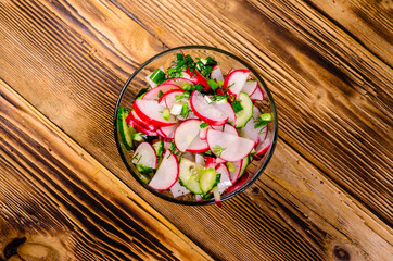 Vegetarian salad with radish and cucumbers. Top view