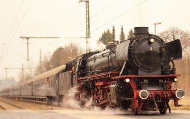 Fototapeta na wymiar vintage black steam powered railway train