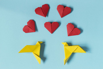 Yellow Birds and Red Hearts. Origami. Gift card for Valentine's Day. Concept sublime love.