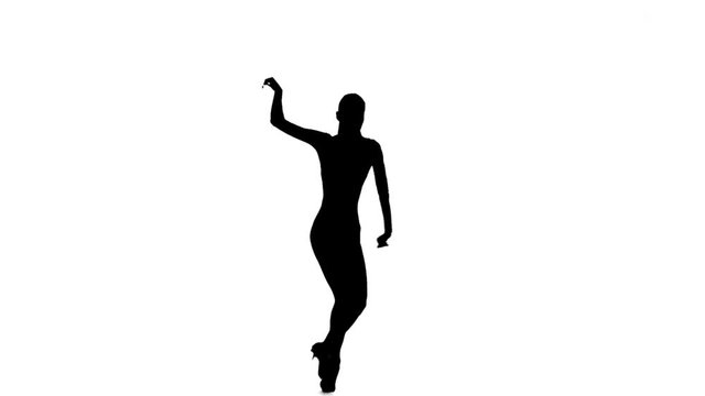 Slim dancer woman dancing latino, slow motion. White background, silhouette
