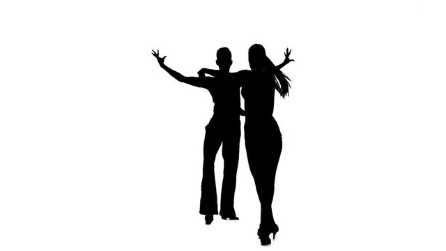 Silhouette couple professional dancers perform samba. White background, slow motion