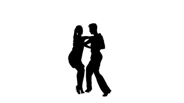 Couple silhouette professional dancing jive on white background. Slow motion