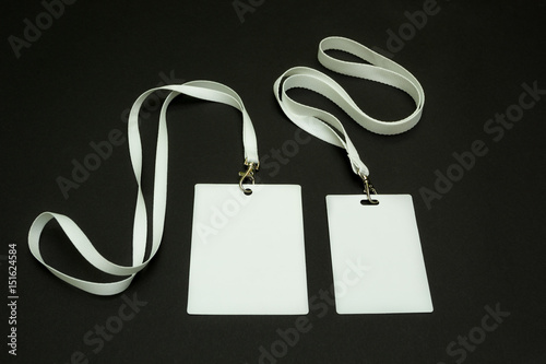 "Two blank ID cards on a black background. Space for text and design