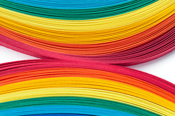 Colored strips of paper for quilling rainbow colors, close-up