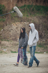 Behind scene. Actor and actress in front of boom microphone © guruXOX