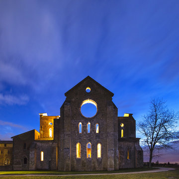 ruines of old abbay in twilight with light in Tuscany in Italy