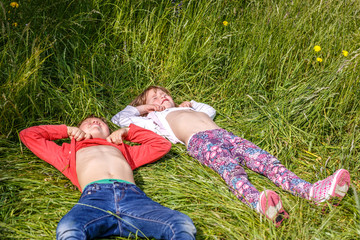 Children in the grass in summer