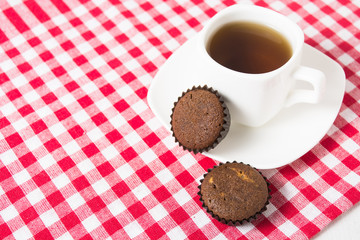 Mini muffins with cup of tea