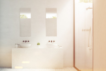 Fototapeta na wymiar Two bathroom sinks with mirrors, toned