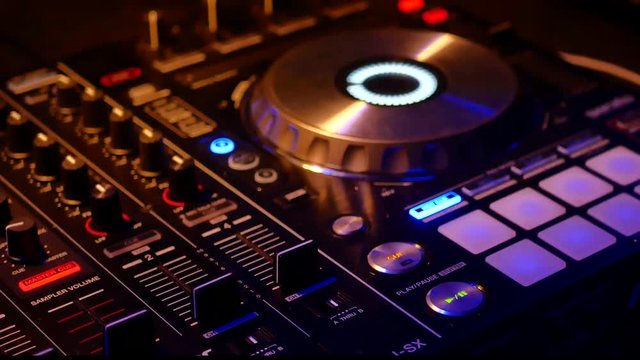 DJ's turntable lights flicker during a  college party