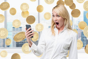 Surprised businesswoman and bitcoins