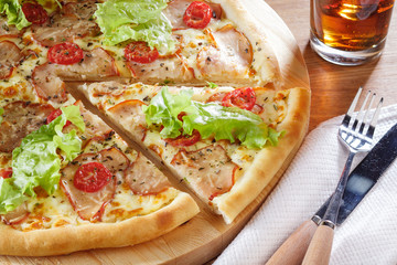 Delicious pizza with salad leaves and bacon. Stock Image