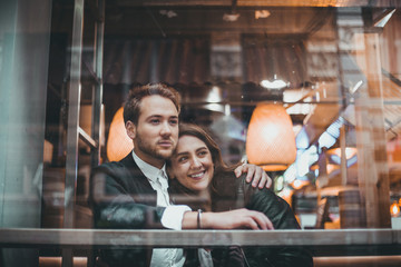 Couple in a cafe having a good time. Couple in love in a cafe.