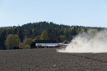 Tractor working in farm field