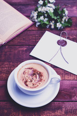 Obraz na płótnie Canvas Drink hot coffee cappuccino on a brown table