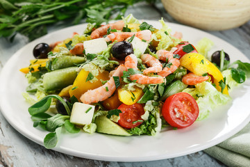 Fresh summer salad with feta cheese and shrimps