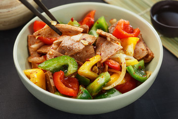 Asian food. Delicious salad with meat and pepper