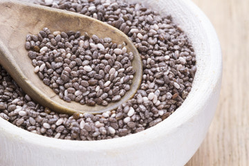Grains of chia in a bowl with spoon - Salvia hispanica