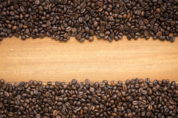 row of coffee beans isolated on white background