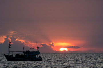 Ship silhouette in sunset light
