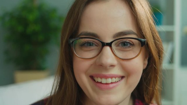 Emotional attractive young woman shows tongue on camera. Beatiful woman having fun posing on camera. Close up.