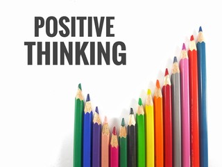 Colorful color pencil on white background with word positive thinking