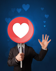 Fototapeta na wymiar Businessman holding heart sign