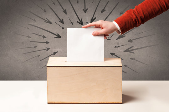close up of a ballot box and casting vote