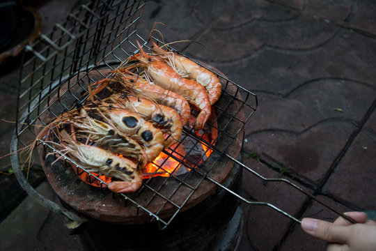 Grill shrimps on stove at camping