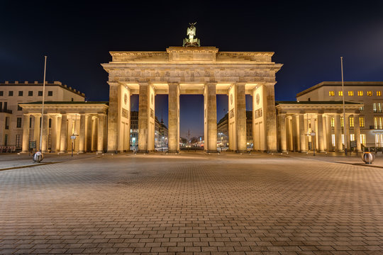 The famous Brandenburg Gate in Berlin illuminated at night