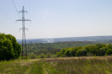 High voltage power line against blue sky