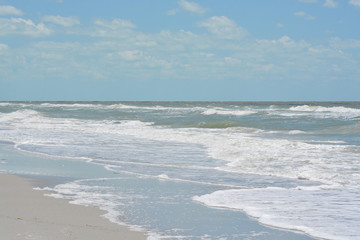 Fototapeta na wymiar Rough surf at Indian Rocks Beach on the Gulf of Mexico in Florida