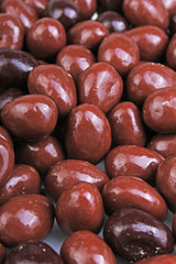Dark and dairy chocolate balls.  Chocolate drops as background texture pattern. Bon bons.