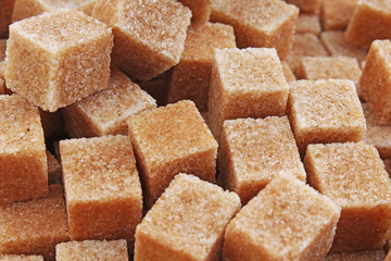 Granulated brown sugar. Lump sugar. Brown sugar cubes. Cane sugar. 