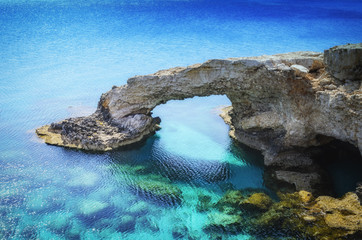 Beautiful natural rock arch near of Ayia Napa, Cavo Greco and Protaras on Cyprus island, Mediterranean Sea. Legendary bridge lovers.
