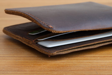 leather wallet on the wooden table