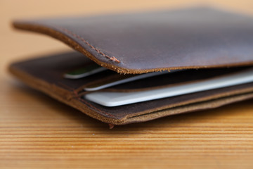 leather wallet on the wooden table