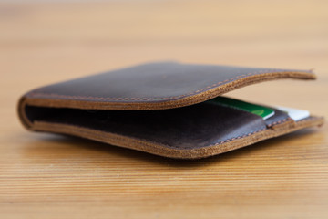 leather wallet on the wooden table