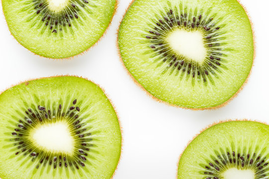 Close up of kiwi slice isolated over white background
