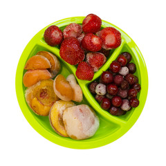 Frozen peaches apricot cherries strawberries isolated on white background