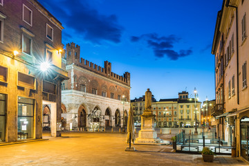 Fototapeta na wymiar Piacenza, medieval town, Italy. Piazza Cavalli (Square horses) and palazzo Gotico (Gothic palace) in the city center on a beautiful day, at dusk. Emilia Romagna