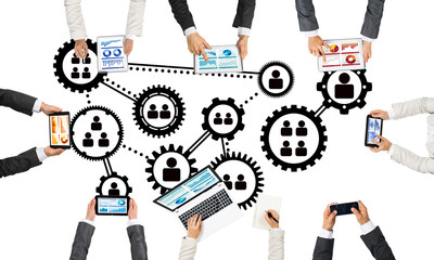 Top view of businesspeople sitting at table and using gadgets