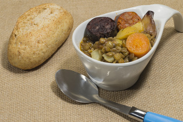 Homemade lentil stew with sausage, carrot and potato