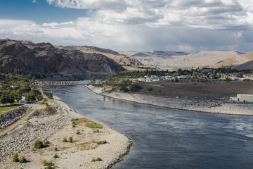 Columbia river roll on through a city of Washington state and long distance town view