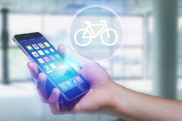 Bicycle icon over device - Sport and technology concept